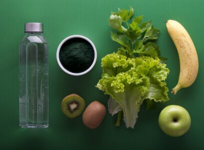 assorted fruits and vegetables on green surface